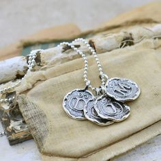 An initial or monogram is a sign of identity.  Wear it to show off your own beautiful identity or wear several to show off those who have created a lasting impression in your heart. Our Lasting Impressions Necklace comes to you in handcrafted sterling silver and on a 16" chain.  If you prefer a longer length, you can select 18, 20, 24 or 30 inches for a small additional fee.  This designer monogram necklace replicates the the lost art of wax seals to identify the writer.  Each silver monogram is Jewelry Initials, Victorian Monogram, Chunky Silver Jewellery, Unique Sterling Silver Jewelry, Dainty Diamond Necklace, Sweet Jewelry, Silver Monogram, Soldering Jewelry, Hand Stamped Necklace