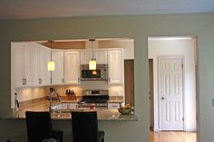 the kitchen is clean and ready to be used as a dining room or living room