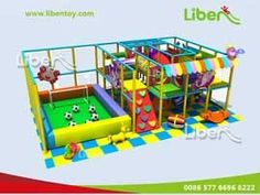 an indoor play area for children with slide and climbing wall, inflatable trampoline