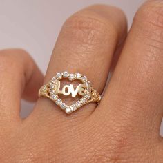 "Cut-Out CZ Love Heart Ring Real 10K Yellow Gold Size 7 * Metal : Real 10K Yellow Gold (Properly Stamped, 10K) * Condition : Brand New * Finish : Polished * Average Weight : 1.74 grams * Size : 7 * Width : 12.5mm x 13mm = Just under 1/2\" x 1/2\" * Clasp/Bail : Can be resized down or up at your local jeweler. All of our items are brand new and are shipped with a gift box." Valentine's Day Gold Diamond Ring, Hypoallergenic Heart-shaped Yellow Gold Jewelry, Valentine's Day Yellow Gold Hallmarked Heart Ring, Valentine's Day Yellow Gold Heart Ring With Charm, Valentine's Day Heart-shaped Yellow Gold Midi Rings, Yellow Gold Heart-shaped Initial Ring For Valentine's Day, Chain Threader Earrings, Threader Earrings, Rings Statement