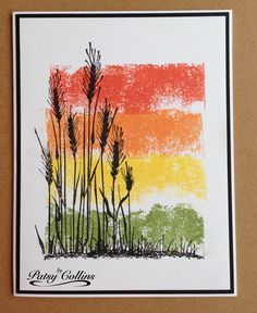 a card with an image of grass and the colors of the rainbow in the background