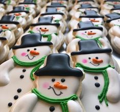 many decorated snowmen are lined up in rows