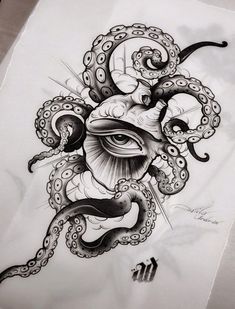 an octopus and eye tattoo design on paper