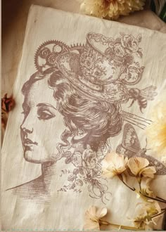 a piece of cloth with an image of a woman's face and flowers on it