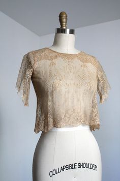 "*SHIPPING ANNOUNCEMENT* Away for the Holidays so enjoy a discount! Will ship sometime before the New Year but unsure exactly which day. GORGEOUS delicate lace cropped blouse from the 1920s. So technically this was once part of a dress set - only the top remained and the second part of the sleeves was silk and completely shattered. I removed that part and restored it into a wearable blouse. It's so truly gorgeous  Label: none Measurements: { xxsmall } Bust: 33\"  Length: 16\" Sleeve Length: 8\" Shoulder to Shoulder: 11.5\" (so I have broad shoulders but petite and I can get it on but it's a bit snug) Condition: as mentioned this was once a different piece in a way so the sleeve ends are unfinished as I wasn't sure how to sew such delicate lace, there is also one teeny break in the lace on 1950s Shirtwaist Dress, Tassel Dress, Shirtwaist Dress, Broad Shoulders, Cropped Blouse, Floral Blue Dress, The 1920s, Dress Set, Crop Blouse