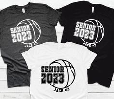 three t - shirts with the words senior and seniors on them, sitting next to each other