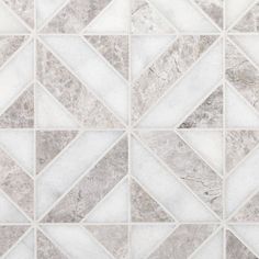 a white and grey tile pattern with an irregular design on it's side,