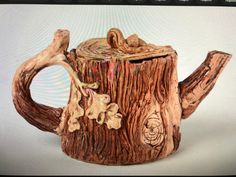 a teapot made out of tree stumps