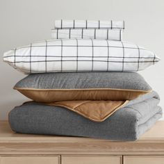 four pillows stacked on top of each other