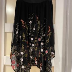 ** Never Worn, New Without Tag. ** Gorgeous Floral Embroidered Skirt. Handkerchief Style. Sheer. The Size Is Medium But Fits Comfortably Due To The Elastic Waistband. Bohemian Handkerchief Hem Skirt, Black Fitted Handkerchief Hem Skirt, Chic Embroidered Black Skirt, Black Floral Embroidery Party Skirt, Hankerchief Skirt, Black Floral Embroidered Skirt, Handkerchief Style, Handkerchief Skirt, Embroidered Skirt