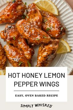 the recipe for hot honey lemon pepper wings is shown on a plate with lemon wedges