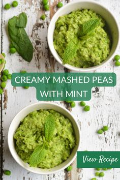 two bowls filled with creamy mashed peas and mint leaves on top of a wooden table