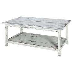 a white coffee table with two shelves on each side