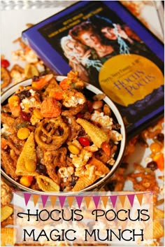 a bowl filled with food next to a book