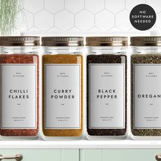 four jars filled with different types of spices on top of a kitchen counter next to the words curry powder, black pepper, and organic