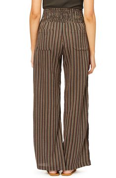 Perfect for casual days spent strolling the boardwalk, this pair of wide-leg pants is fashioned with a stripe pattern and smocked waist. 31 1/2" inseam; 23" leg opening; 13" front rise; 16" back rise (size Medium) Smocked waist Side-seam pockets; back patch pockets 100% cotton Hand wash, line dry Imported Women's Clothing Off Black, Billabong, Stripes Pattern, Leg Pants, Wide Leg Pants, Harem Pants, Women's Clothing, Wide Leg, Hand Wash