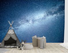 there is a teepee tent and other items in front of the stars wall mural