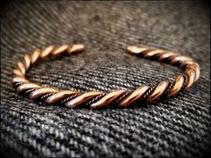 A twisted viking bracelet in bronze, authentically hand made. Finished with rounded ends and polished to a high shine. Adjustable, can be easily bent to fit any size wrist. Copper Work, Bracelet Viking, Twisted Bracelet, Viking Bracelet, Brass Bracelet, Ancient Jewelry, Viking Jewelry, Beautiful Bracelet, Mens Bracelet