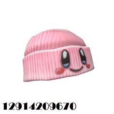 a pink beanie hat with a smiley face on it