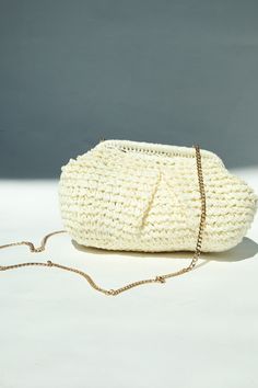 Get ready to turn heads this summer with our Portofino Raffia Clutch! Made with woven raffia, this versatile clutch comes with a removable gold chain for a stylish cross body option. With a clam style closure and lined interior, it's the perfect accessory for any summer event. Available in 2 colors. ALL SALE ITEMS ARE FINAL SALE Raffia Clutch, Woven Raffia, Summer Events, Earring Necklace, 2 Colours, Gold Chain, Gold Chains, This Summer, Cross Body