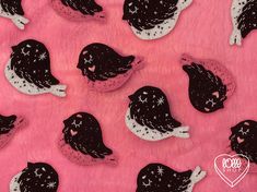 black and white hats on pink fabric with hearts in the background for valentine's day