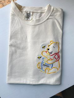 Winnie The Pooh Hunny Pot, Pooh Hunny Pot, Winnie The Pooh Hunny, Cute Disney Shirts, Winnie The Pooh Shirt, Embroidered T Shirt, Embroidery Clothing, Cute Disney Outfits, Disney Embroidery