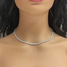 A classic and elegant everyday or occasional wear the Beauvince Adjustable Length Cupcake Tennis Necklace is a timeless and versatile piece of jewelry. It can we worn at any length between 13 inches 30 inches ranging from a choker to a long layer. Total Diamond Weight: 7.18 ct Diamond Color: G - H Diamond Clarity: SI - I (Slightly Included - Included) Metal: 14K White GoldMetal Weight: 18.35 gms Setting: Prong Set Length: 13 - 30 inches Formal Single Strand Round Diamond Necklace, Formal Single Strand Diamond Necklace, Classic Single Strand Round Diamond Necklace, Elegant Single Strand Round Tennis Necklace, Classic Round Single Strand Diamond Necklace, Elegant Single Strand Tennis Necklace, Luxury Single Strand Diamond Necklace For Formal Occasions, Diamond White Solitaire Single Strand Necklace, Luxury Single Strand Diamond Necklace For Formal Events