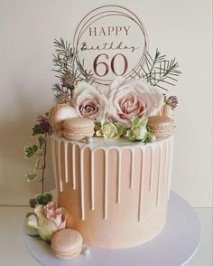 a birthday cake decorated with flowers and icing