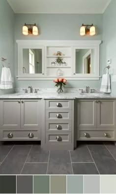 a bathroom with two sinks and gray cabinets