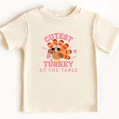 Grab this shirt for the cutest turkey at your table this Thanksgiving! Uplift any child's wardrobe with a custom kid's t-shirt. The Bella Canvas short sleeve tee for toddlers is a 100% Airlume combed and ring-spun cotton jersey with a tear-away label for extra comfort. Choose your favorite color out of a big variety, and make unique staples that toddlers will happily wear every day.  .: 100% airlume combed and ring-spun cotton (fiber content varies for different colors) .: Extra light fabric (3. Turkey Bow, Fall Tshirt, Funny Fall, Girls Fall, Toddler Fall, Autumn T Shirts, Thanksgiving Shirt, At The Table, Thanksgiving Shirts