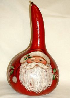 a red vase with a santa clause on it