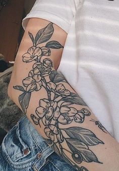 a person with a flower tattoo on their arm