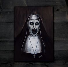 a painting of a nun with yellow eyes and a cross on it's chest