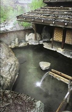 an outdoor hot tub with water running from it