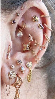 an ear with many different types of piercings on it