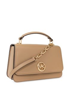 Find MICHAEL KORS Logo-plaque Leather Tote Bag on Editorialist. This Michael Kors tote bag is crafted from calf leather and features a smooth grain finish. It has a gold-tone logo plaque, a single top handle, and a detachable leather and chain-link shoulder strap. The bag has a foldover top with a magnetic fastening and a main compartment with an internal logo patch. The lining is logo-printed and the hardware is gold-tone. This bag comes with a protective dust bag. Michael Kors Soft Leather Satchel, Michael Kors Leather Top Handle Satchel, Michael Kors Rectangular Leather Bag, Leather Tote Flap Bag With Branded Hardware, Leather Flap Tote Bag With Branded Hardware, Classic Michael Kors Leather Bag, Classic Leather Michael Kors Bag, Michael Kors Leather Shoulder Bag With Leather Lining, Michael Kors Leather Top Handle Bag