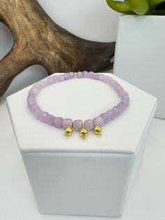 Delicate Kunzite beaded bracelet with handmade 18KYG ball charms Adjustable Yellow Gold Beaded Bracelets With Faceted Beads, Faceted Yellow Gold Beaded Bracelets, Yellow Gold Faceted Beaded Bracelets, Gold Beaded Rondelle Bracelets, Gold Rondelle Gemstone Beaded Bracelets, Gold Rondelle Beaded Bracelets With Gemstones, Yellow Gold Rondelle Beaded Bracelets With Polished Beads, Yellow Gold Rondelle Beaded Bracelets, Gold Charm Bracelet With Gemstone Round Beads