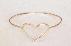 Heart bangle - 14k gold filled heart bangle - heart jewelry - bridesmaid gift. Heart Charm Bangle Bracelet For Wedding, Wedding Heart Charm Bangle Bracelets, Wedding Bangle Bracelet With Heart Charm, Heart-shaped Bangle For Valentine's Day, Delicate Heart Bracelet For Wedding, Gold Heart Shaped Bangle For Anniversary, Gold Heart-shaped Bangle For Anniversary, Handmade Heart Bracelet For Weddings, Gold Heart-shaped Bangle