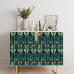 a sideboard with an abstract design on the front and sides in blue, green, yellow and white