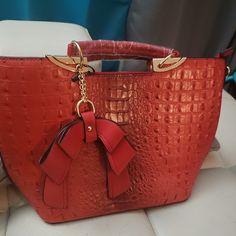 Beautiful Handbag That Is Red Carpet Ready. It Has A Alligator Decor. A Real Head Turner. Red Leather Satchel With Crocodile Pattern, Red Top Handle Bag With Crocodile Pattern, Red Double Handle Bag With Crocodile Pattern, Red Crocodile Pattern Shoulder Bag For Shopping, Red Crocodile Pattern Shoulder Bag, Formal Red Crocodile Pattern Shoulder Bag, Luxury Red Bags With Crocodile Pattern, Red Bucket Satchel For Shopping, Red Top Handle Bag As Fashion Accessory