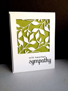 a card with leaves on it that says sympathy