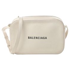 This shoulder bag is constructed of soft calfskin leather in white. The handbag features a rear patch pocket, Balenciaga logo in white and has a thin adjustable leather strap. The bag with is finished with a black leather interior. COLOR: White MATERIAL: Calfskin leather ITEM CODE: 552370 MEASURES: H 6.25” x L 9.25” x D 2.25” DROP: 20.25” EST. RETIAL: $1695 COMES WITH: Dust bag CONDITION: Very good - slight signs of wear to interior and with minor discolouration at zipper. Made in Italy Vintage Balenciaga, Balenciaga Logo, City Bag, Interior Color, D 2, Leather Items, Leather Interior, White Bag, Michael Kors Jet Set