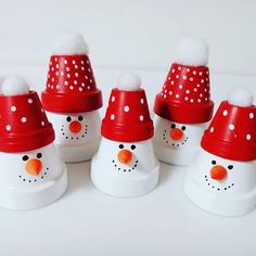 six snowmen with red hats and white dots on them