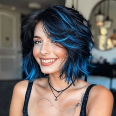 55 Bixie Haircut Ideas That Prove This Bold Style Is The Ultimate Trend Pixie Haircut Blue Highlights, Peacock Color Hair, Bold Color Highlights Hair, Electric Blue Highlights In Black Hair, Blue Black Hair Color With Highlights, Midnight Blue Short Hair, Side Part Hair Cuts Women, Dark Vibrant Hair, Blue To Black Hair