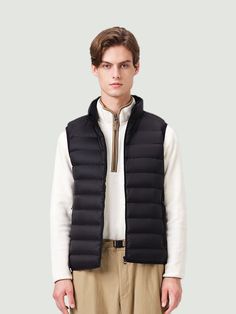 TANBOER Men's Lightweight Standing Collar Down Vest Tanboer Unique Design: Experience Tanboer's distinctive design philosophy with the down vest. The vest seamlessly combines modern elements, ensuring a unique and stylish appearance that sets it apart from conventional vest. Comfortable Material: Enjoy unparalleled comfort with the premium materials used in this down vest. Crafted from 100% nylon, the vest not only provides exceptional warmth but also offers a soft and luxurious feel against you Black Vest With Padded Collar, Functional Black Vest With Padded Collar, Black Functional Vest With Padded Collar, Functional Black Down Vest, Black Down Vest For Outdoor, Functional Down Vest For Winter, Design Philosophy, Modern Elements, Standing Collar