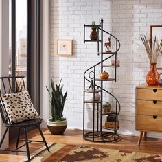 a living room filled with furniture next to a brick wall and floor covered in wooden floors