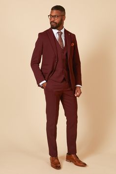 Spotted comedy legend Ade Edmondson in our Max Wine Suit. Command attention with undeniable sophistication in this dashing three-piece wine burgundy suit. This exquisite design is crafted from a diamond textured fabric and fastened with wine-hued tortoiseshell buttons for irresistible refinement. A surefire way to revitalize your workwear and turn heads, this suit is the epitome of class and style! Model wears size 42R blazer, 40R waistcoat & 34R trousers. Features Slim fit Single-breasted Notch Oxblood Suit Wedding, Navy Suit Wedding, Tweed Wedding Suits, Cream Suit, Double Breasted Waistcoat, Suit Ideas, Burgundy Suit, Stylish Suit, Checked Trousers