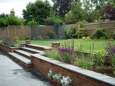 an outdoor garden with steps leading up to it