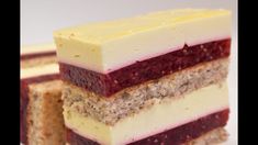 three slices of cake are stacked on top of each other, with different toppings