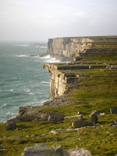 an image of the ocean and cliffs that look like they have been built on land